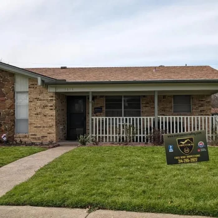 Completed residential roofing project with Montesco yard sign
